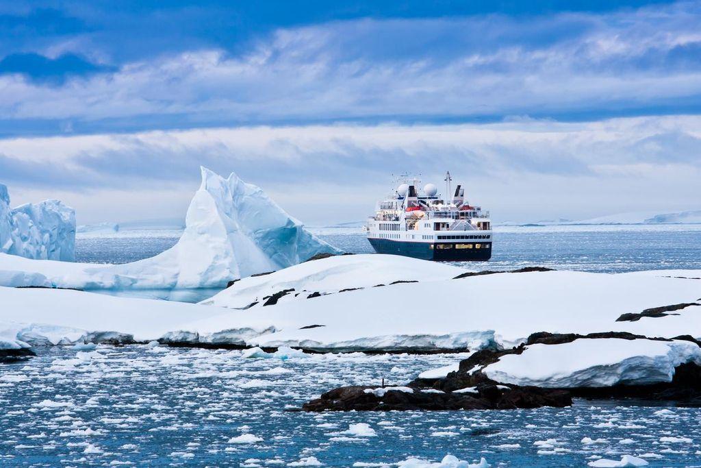 Sail among glaciers in Antarctica.