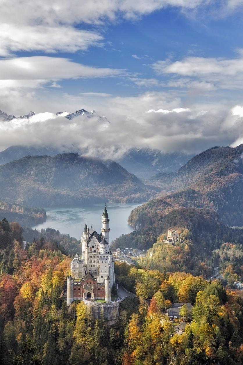 The image of the castle with Lake Alpsee in the background