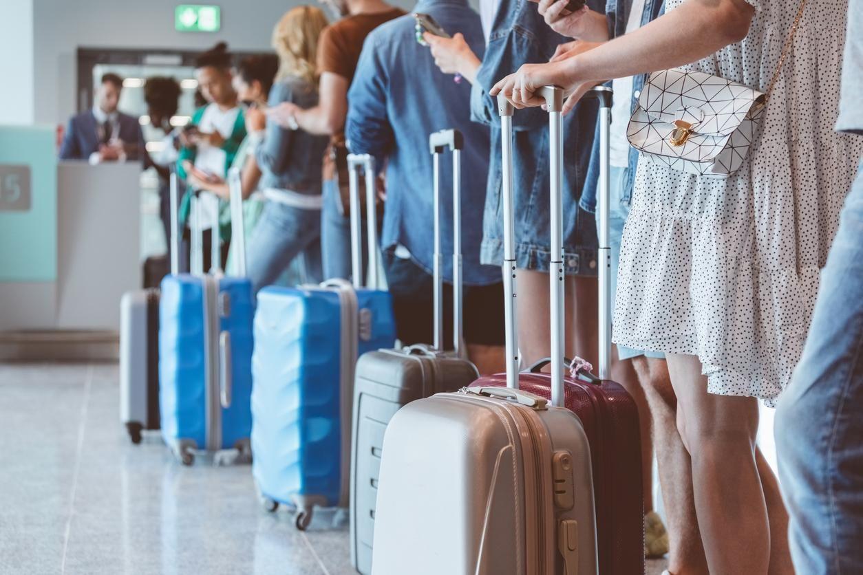 If you quickly get in line, you will be able to board with your suitcase.