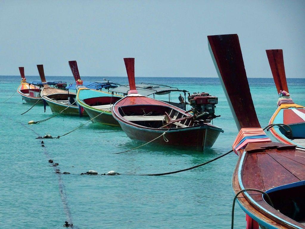 Thailand. A line of boats on the island of Ko Lipe, located in the Andaman Sea. Popular for its wild beaches, it is colloquially known to tourists as the Maldives of Thailand