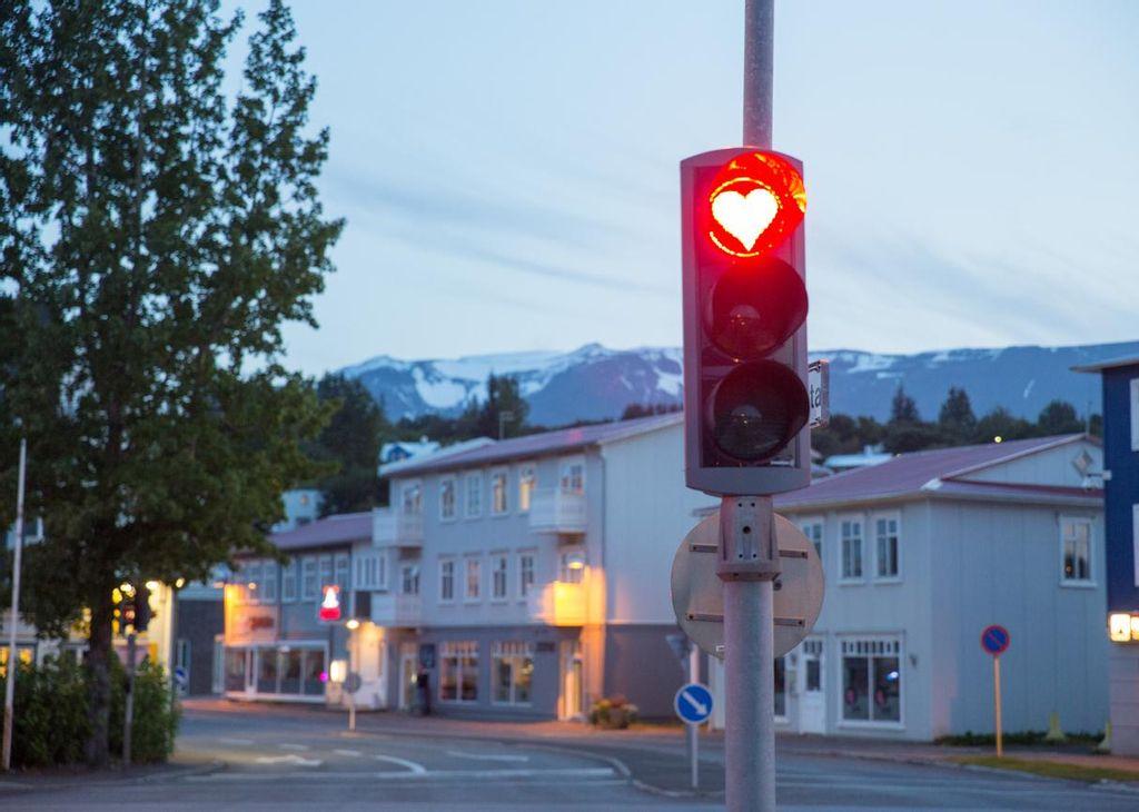 Traffic signal with a heart in Akureyri, Iceland.