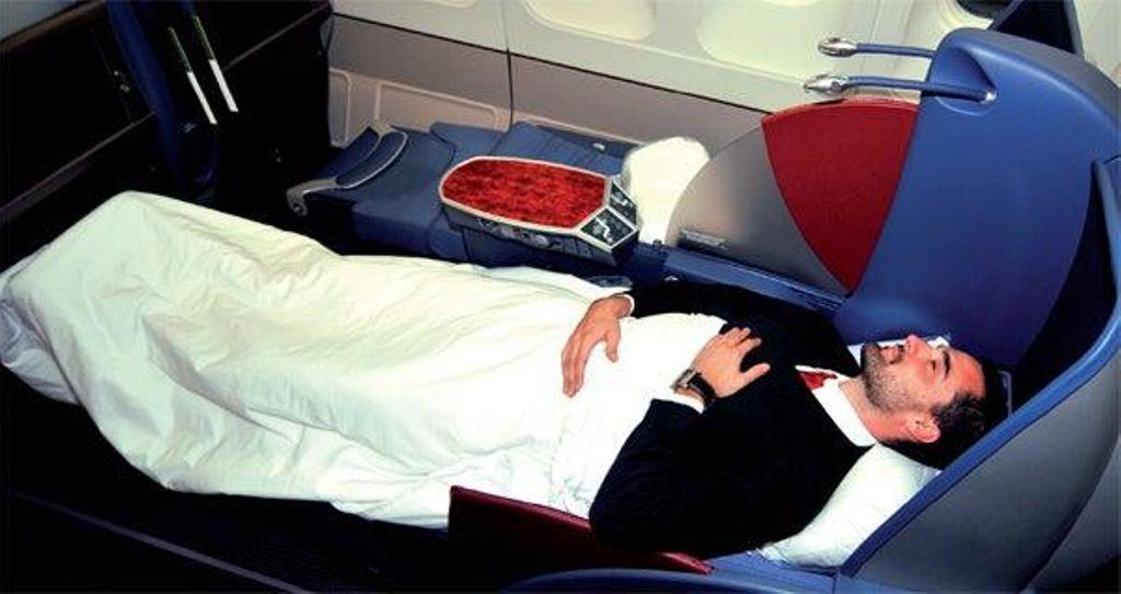 The updated "full flat" seats in Premium Class recline to a full horizontal position